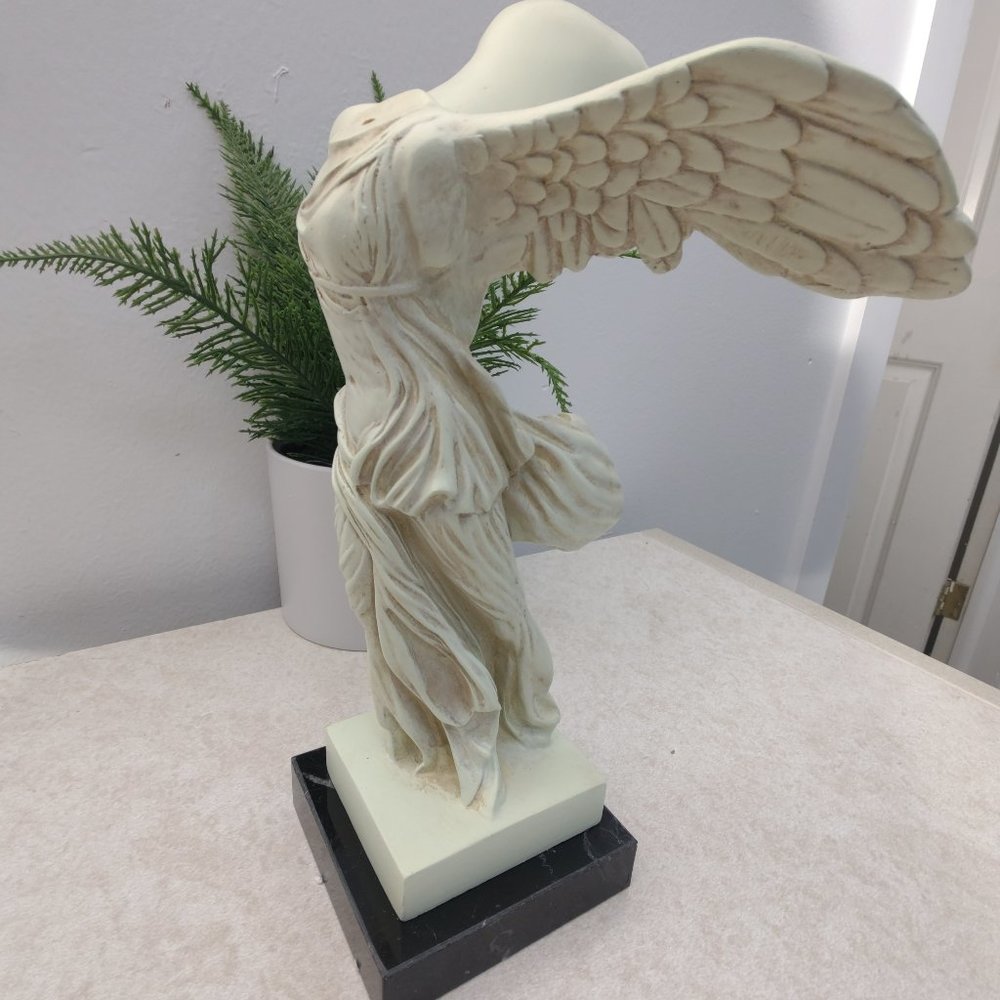 Small Nike (Winged Victory) : The Louvre Museum.